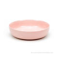 Cena reactiva de gres glaseada colocada en rosa